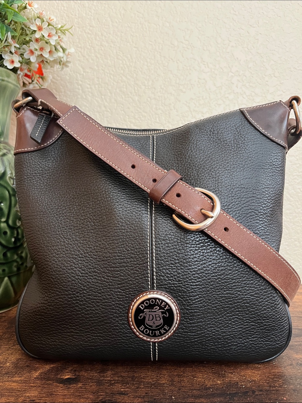 Dooney & Bourke black pebble leather shoulder bag with brown leather trim